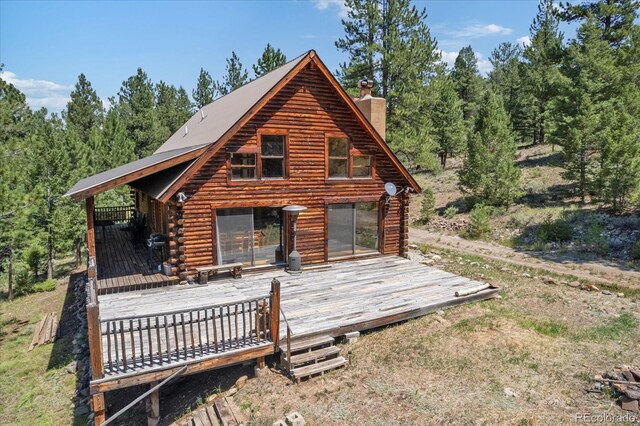 rear view of property with a deck