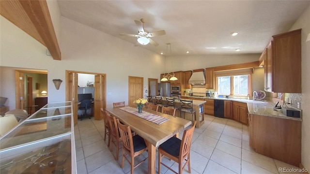 tiled dining space featuring high vaulted ceiling and ceiling fan