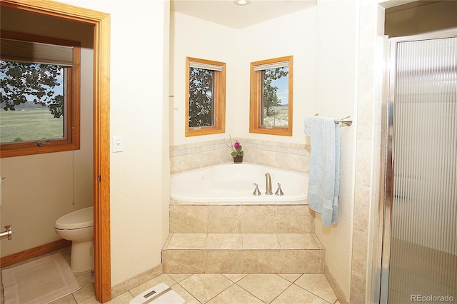 bathroom with independent shower and bath, tile patterned floors, and toilet