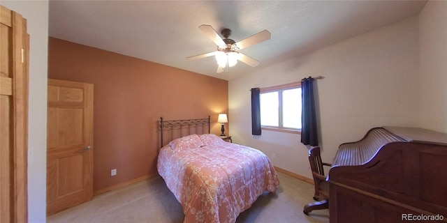 carpeted bedroom featuring ceiling fan and lofted ceiling