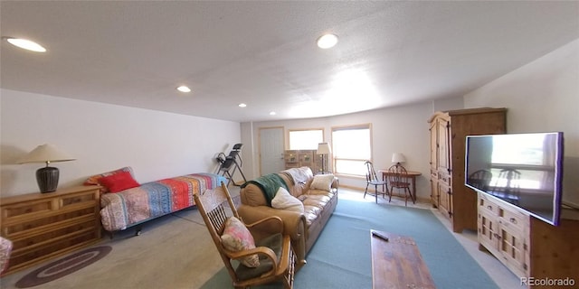 carpeted living room featuring a textured ceiling