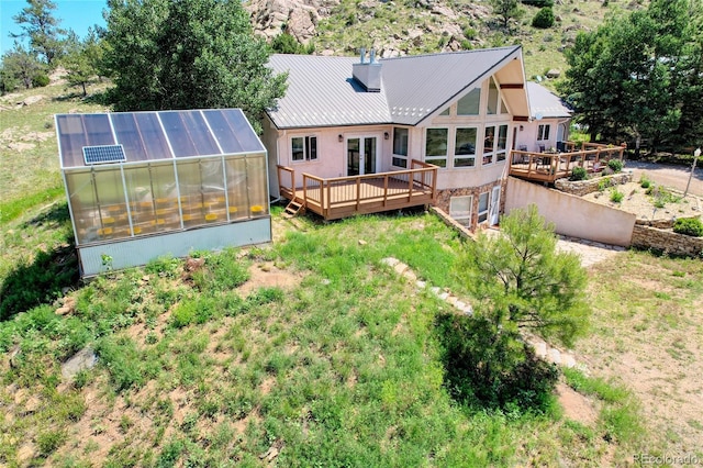 rear view of house with a deck