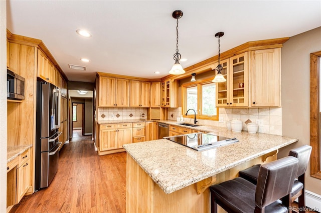8788 E Tanglewood Rd, Franktown, CO 80116 - kitchen featuring a peninsula, stainless steel appliances, a sink, glass insert cabinets, and recessed lighting