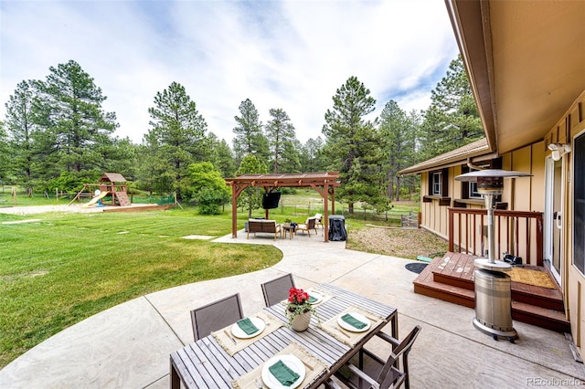 8788 E Tanglewood Rd, Franktown, CO 80116 - view of patio featuring view of wooded area, a pergola, and a playground