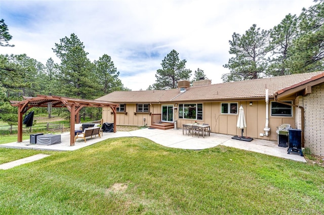 8788 E Tanglewood Rd, Franktown, CO 80116 - back of house featuring board and batten siding, a pergola, a chimney, and a patio area