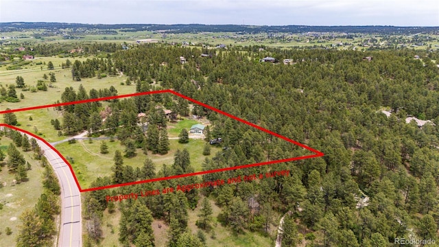 8788 E Tanglewood Rd, Franktown, CO 80116 - aerial view of property's location featuring property boundaries highlighted and a heavily wooded area