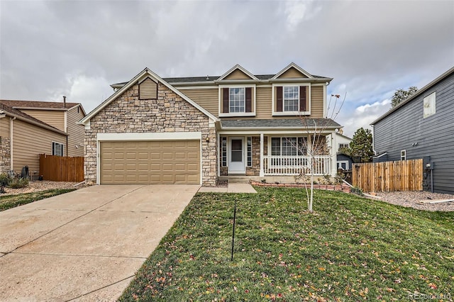 front of property with a front yard, a garage, and a porch