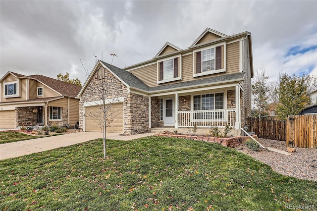 front of property with a porch, a front lawn, and a garage