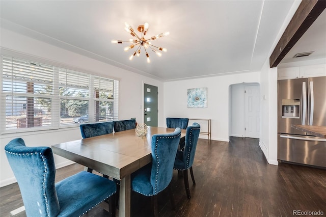 dining room featuring baseboards, dark wood-type flooring, visible vents, and a notable chandelier