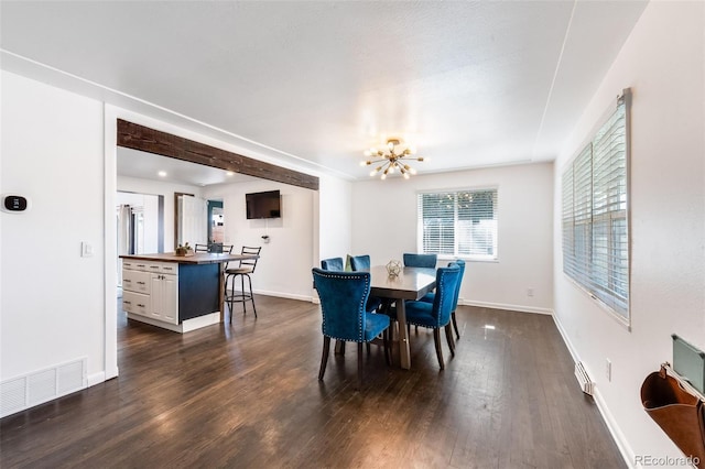 dining area with dark wood-style floors, baseboards, visible vents, and an inviting chandelier