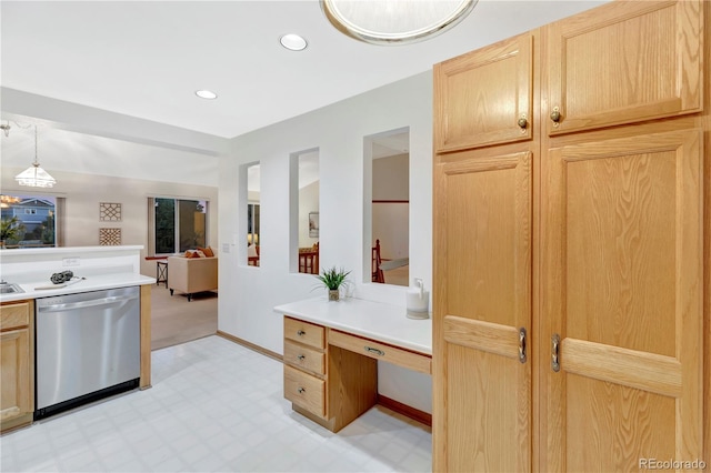 kitchen with stainless steel dishwasher, hanging light fixtures, and light brown cabinetry