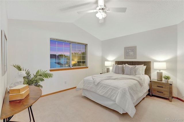 carpeted bedroom featuring baseboards, ceiling fan, and vaulted ceiling