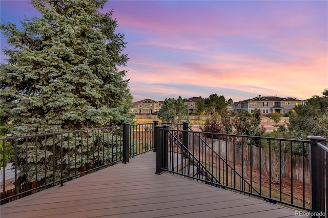 deck at dusk with a residential view