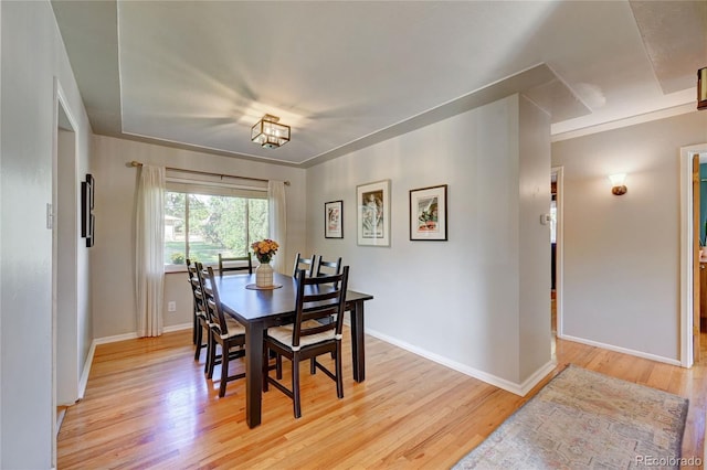 dining room with light hardwood / wood-style flooring