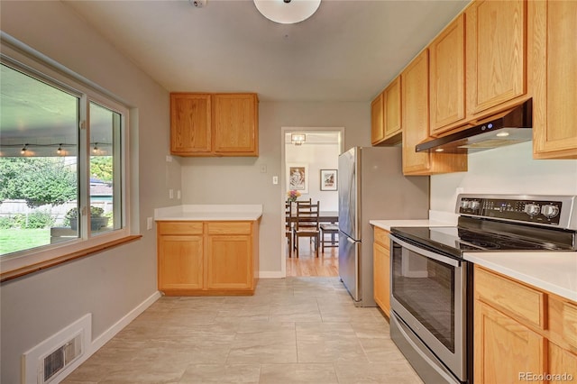 kitchen featuring stainless steel electric stove and light brown cabinetry