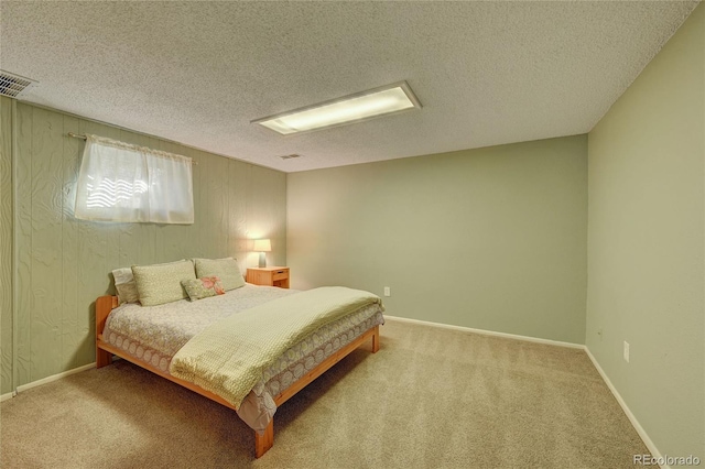 carpeted bedroom with a textured ceiling