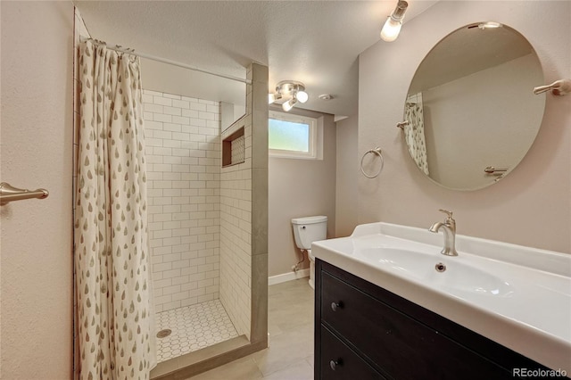 bathroom with a textured ceiling, toilet, vanity, and a shower with curtain