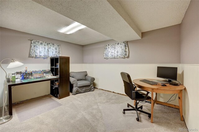 office space featuring carpet floors and a textured ceiling