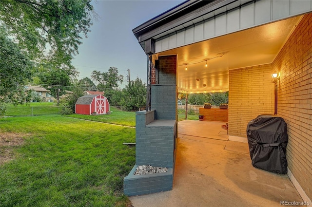 view of yard with a patio area and a shed