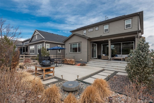 back of property featuring a patio area