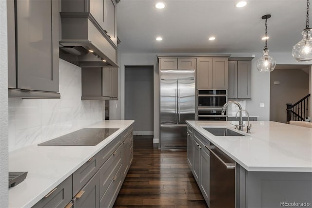 kitchen with stainless steel appliances, recessed lighting, gray cabinets, tasteful backsplash, and a sink