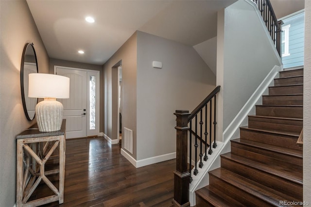 entrance foyer featuring dark wood-style flooring, recessed lighting, visible vents, baseboards, and stairs