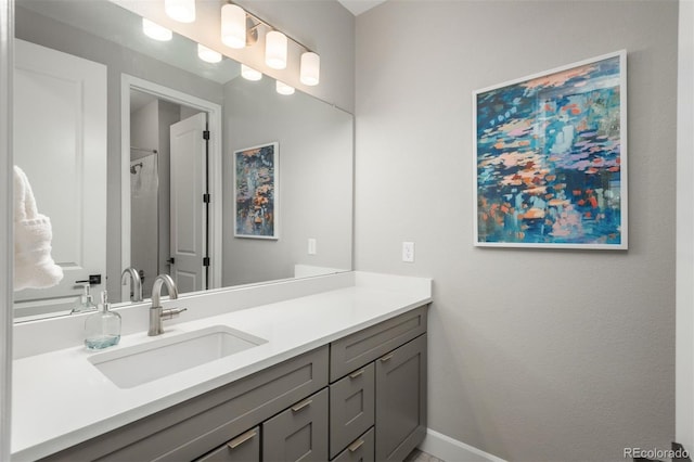 bathroom featuring vanity and baseboards