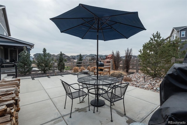 view of patio featuring outdoor dining area and a grill