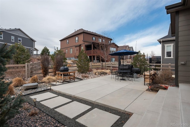 view of patio / terrace featuring outdoor dining area and fence