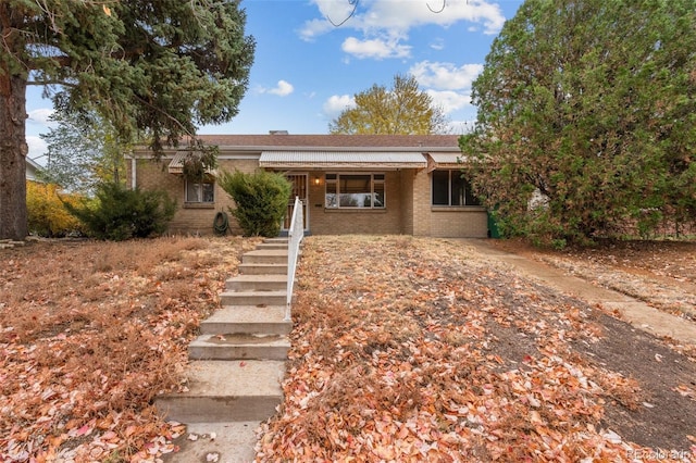 single story home with covered porch