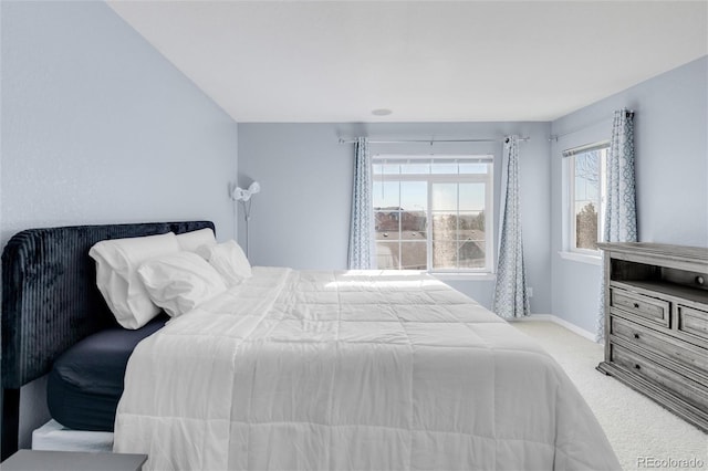 bedroom with carpet flooring and baseboards