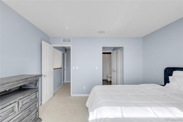 bedroom with baseboards, visible vents, and light colored carpet