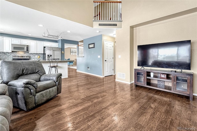 living room with dark hardwood / wood-style floors