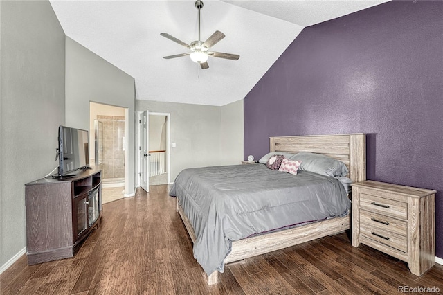 bedroom with ensuite bathroom, vaulted ceiling, ceiling fan, and dark wood-type flooring