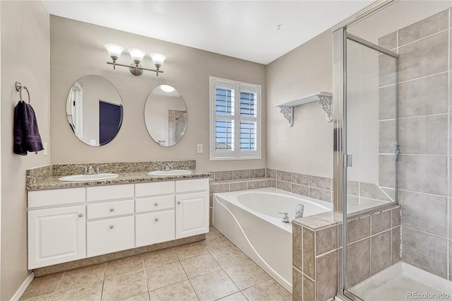 bathroom featuring tile patterned floors, vanity, and independent shower and bath