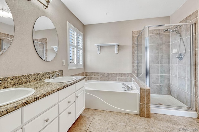 bathroom featuring tile patterned floors, vanity, and separate shower and tub