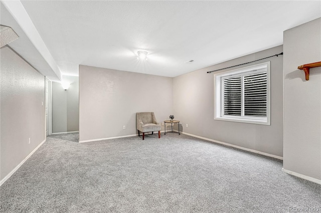 unfurnished room featuring light colored carpet