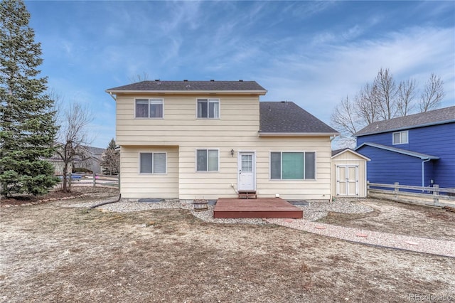 rear view of house featuring a wooden deck