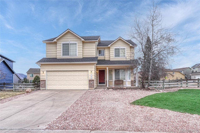 view of front of property featuring a garage and a front yard