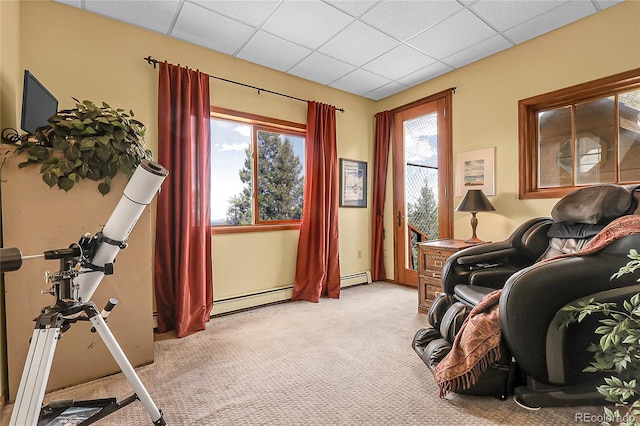 interior space featuring a baseboard radiator, a paneled ceiling, and light colored carpet