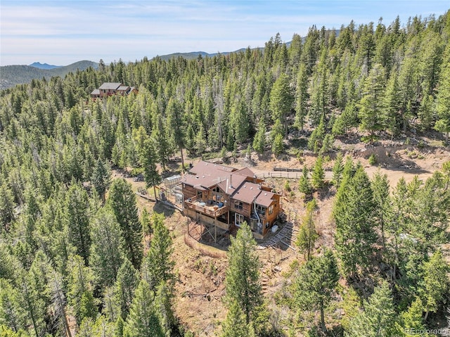 bird's eye view with a view of trees and a mountain view