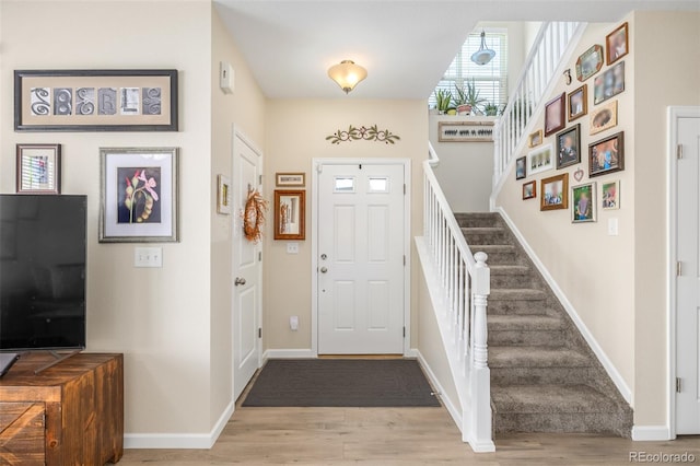 entryway with light hardwood / wood-style flooring