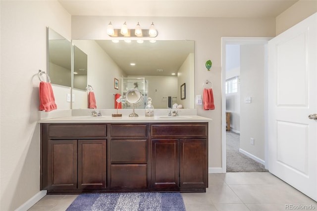 bathroom featuring tile patterned flooring and vanity