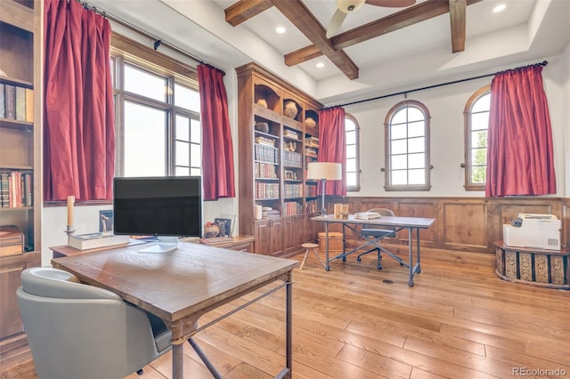 7767 Dante Dr, Littleton, CO 80125 - office area featuring beam ceiling, hardwood / wood-style floors, coffered ceiling, plenty of natural light, and a wainscoted wall
