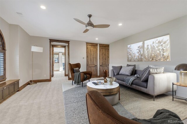 7767 Dante Dr, Littleton, CO 80125 - living room with ceiling fan, baseboards, recessed lighting, and light carpet