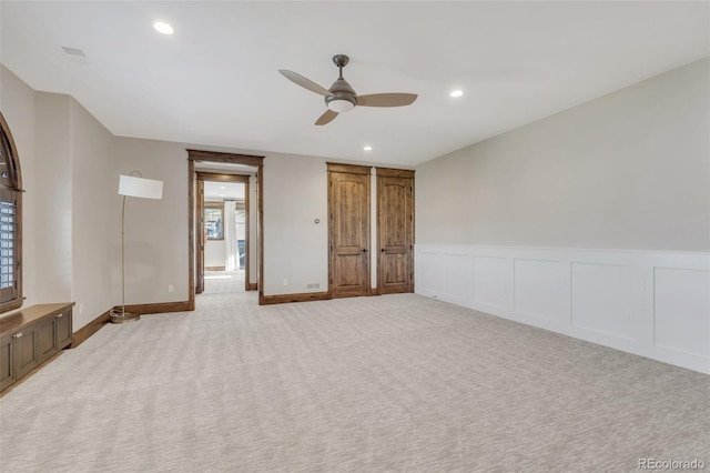 7767 Dante Dr, Littleton, CO 80125 - empty room featuring ceiling fan, light colored carpet, recessed lighting, and wainscoting