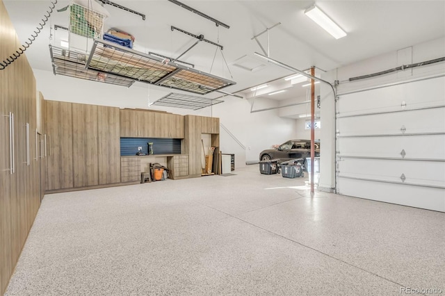 7767 Dante Dr, Littleton, CO 80125 - garage featuring wooden walls