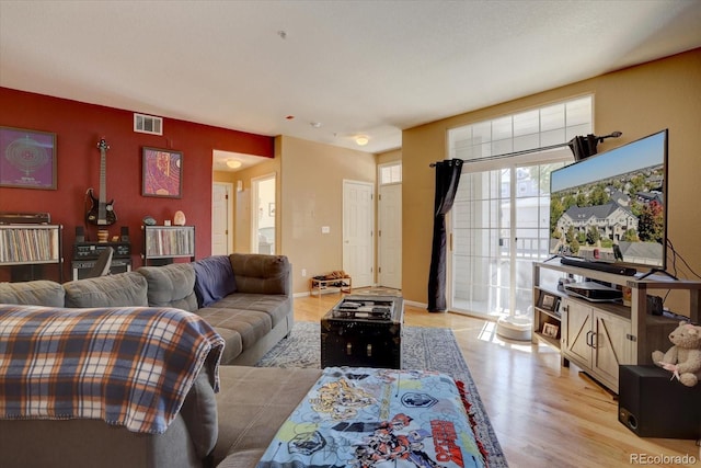 9448 E Florida Ave Unit 1078, Denver, CO 80247 - living area with visible vents and light wood-style flooring