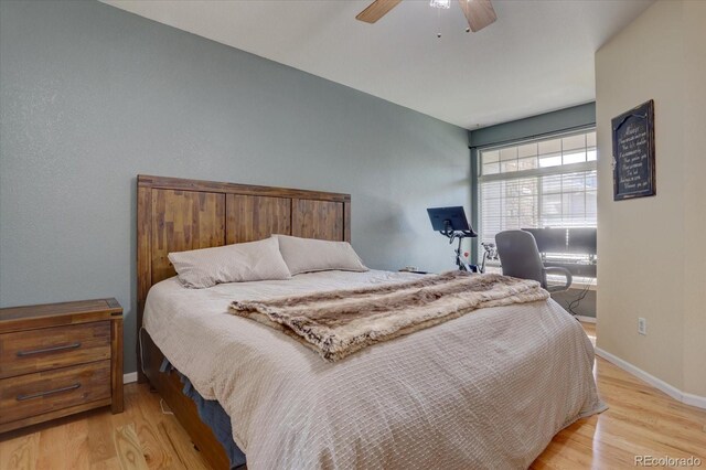 bedroom featuring light wood-type flooring and ceiling fan