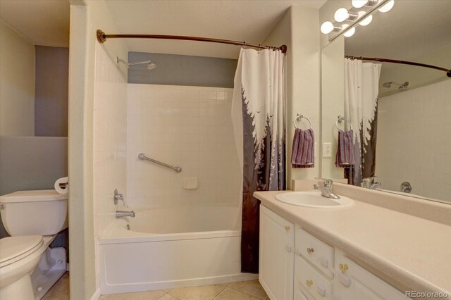 full bathroom featuring vanity, shower / bath combination with curtain, toilet, and tile patterned flooring